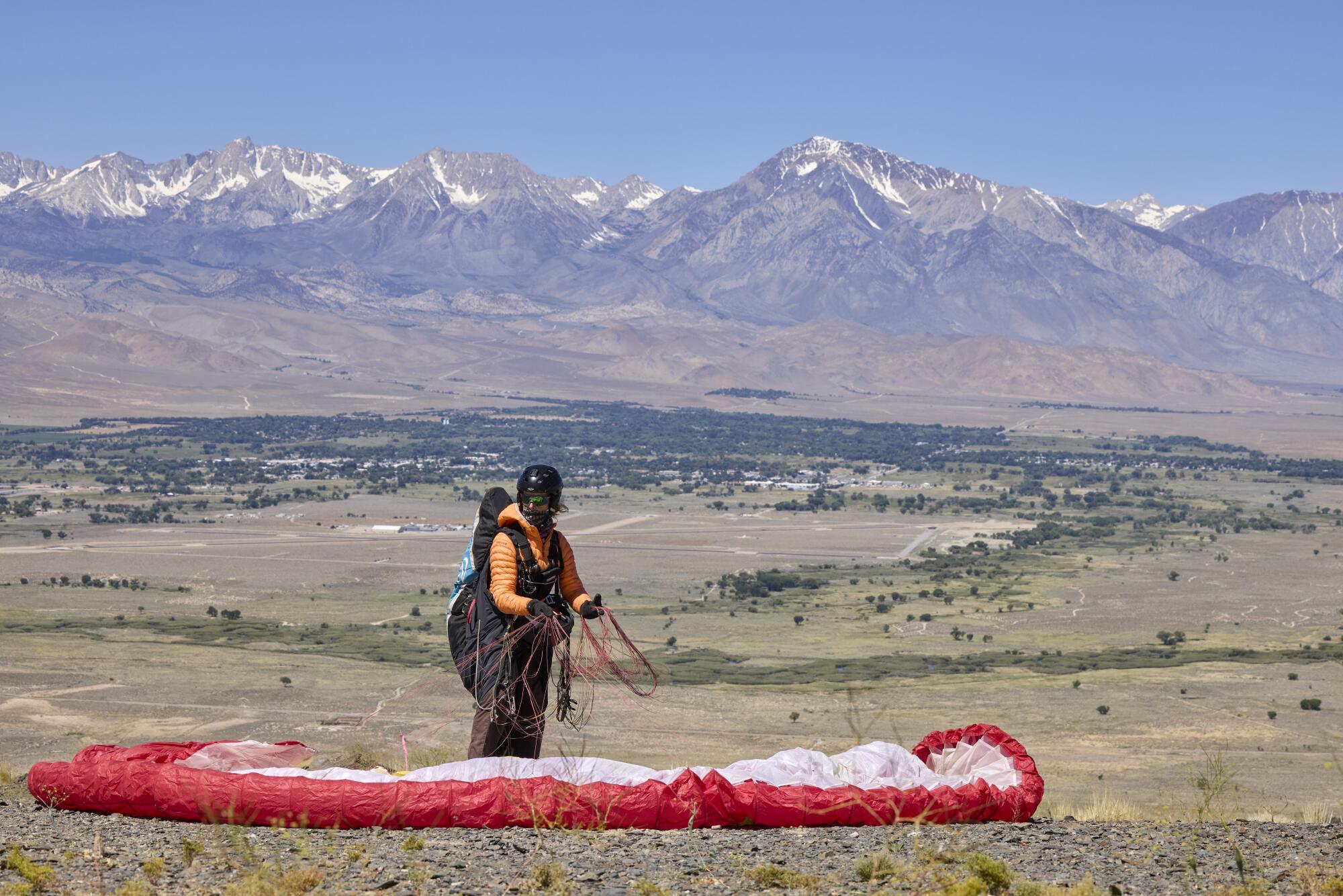 Kari Castle gets ready to launch her paraglider