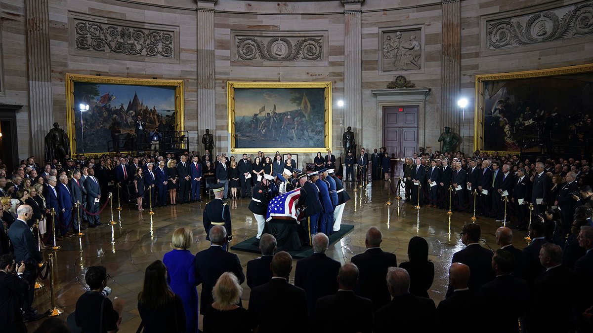 An Armed Forces Body Bearer Team places the flag-draped casket of Sen. Lindsey Graham of South Carolina, in the Rotunda of the U.S. Capitol, Tuesday, July 28, 2026, in Washington. (AP Photo/Allison Robbert)