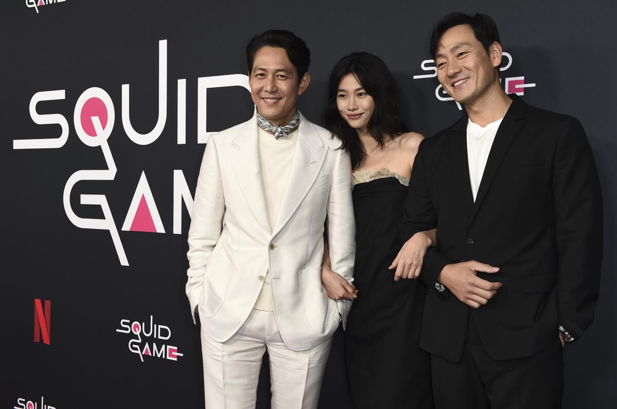 "Squid Game" cast members arrive at a red carpet event at NeueHouse Hollywood in 2021.