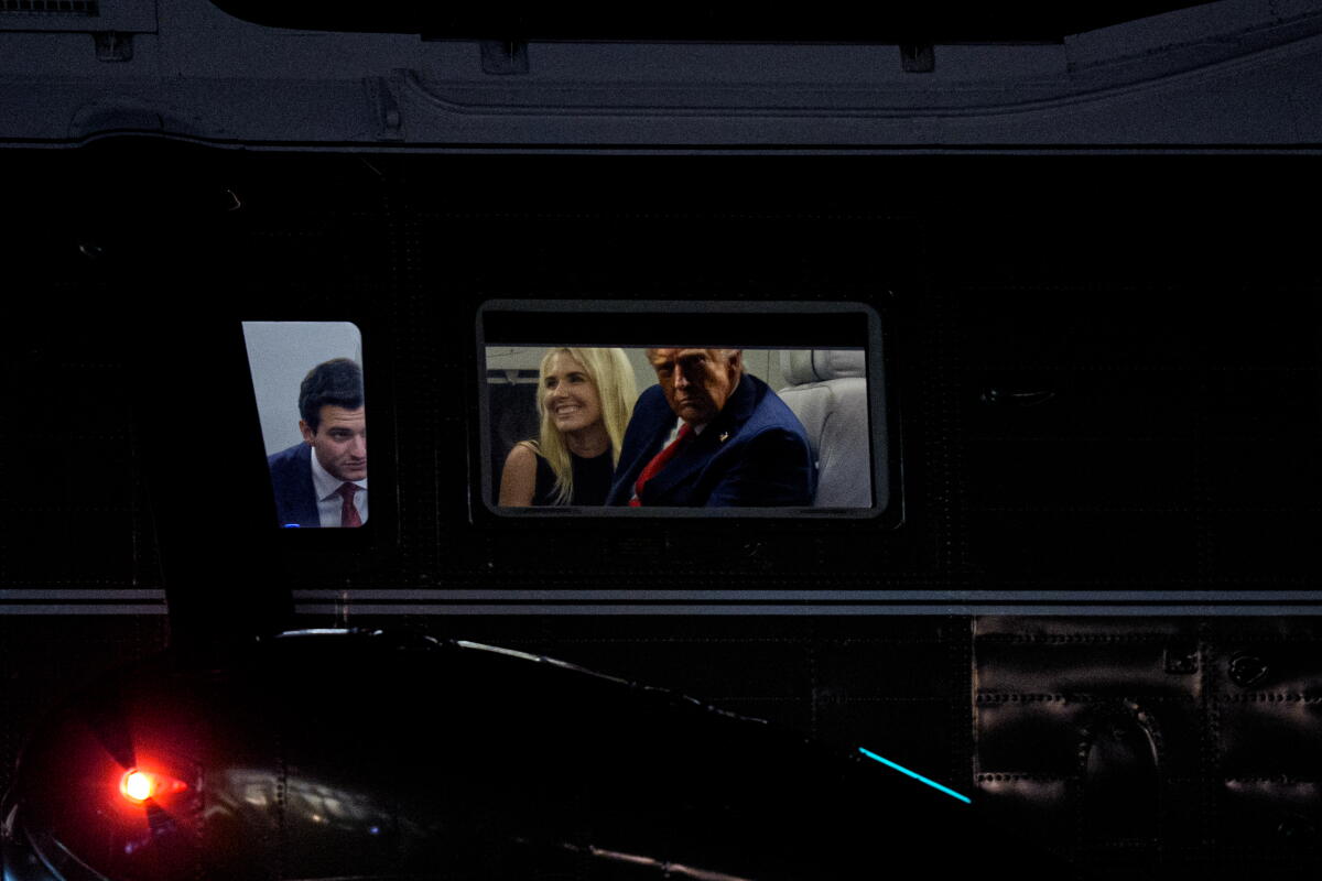 President Trump, right, accompanied by Tiffany Trump's husband, Michael Boulos, left, and aide Natalie Harp