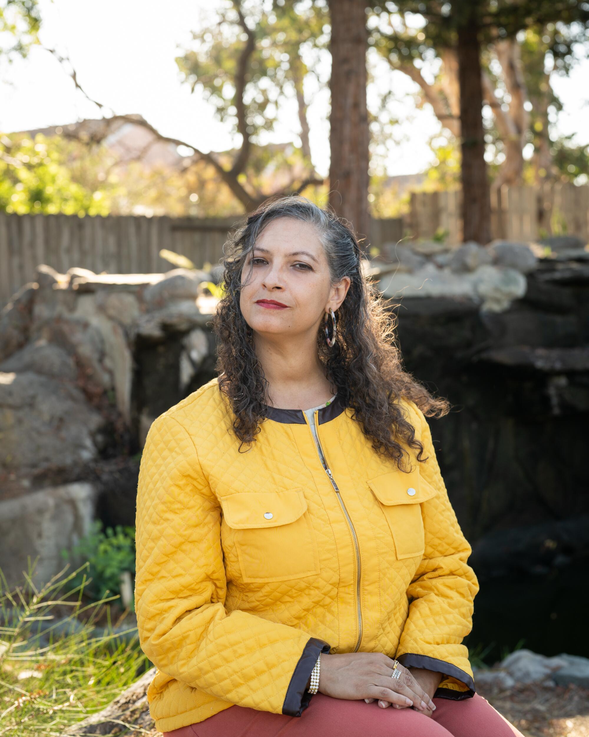 Candidate Katrina Garcia seated for a portrait at a park
