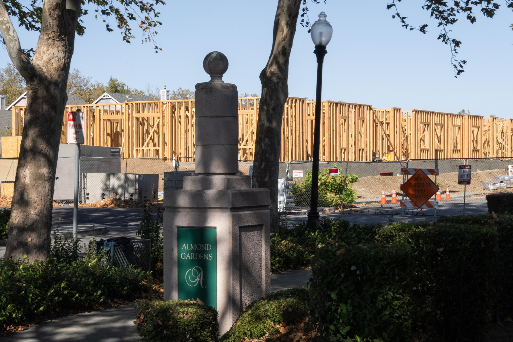 A construction site is visible from a park