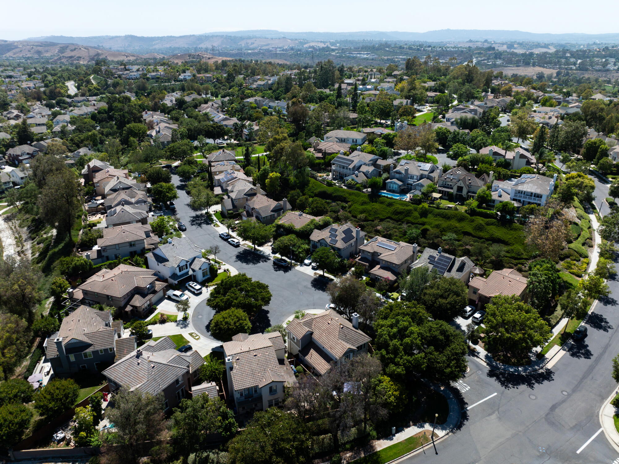 an aerial of homes in a suburban neighborhood