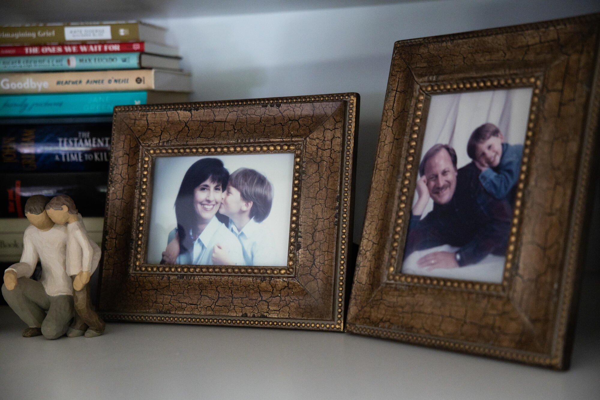 Framed pictures of Ryan Regan as a child with his mother and father.
