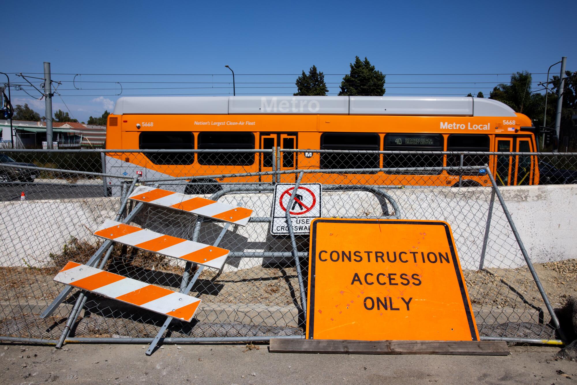 A Metro bus passing a construction site