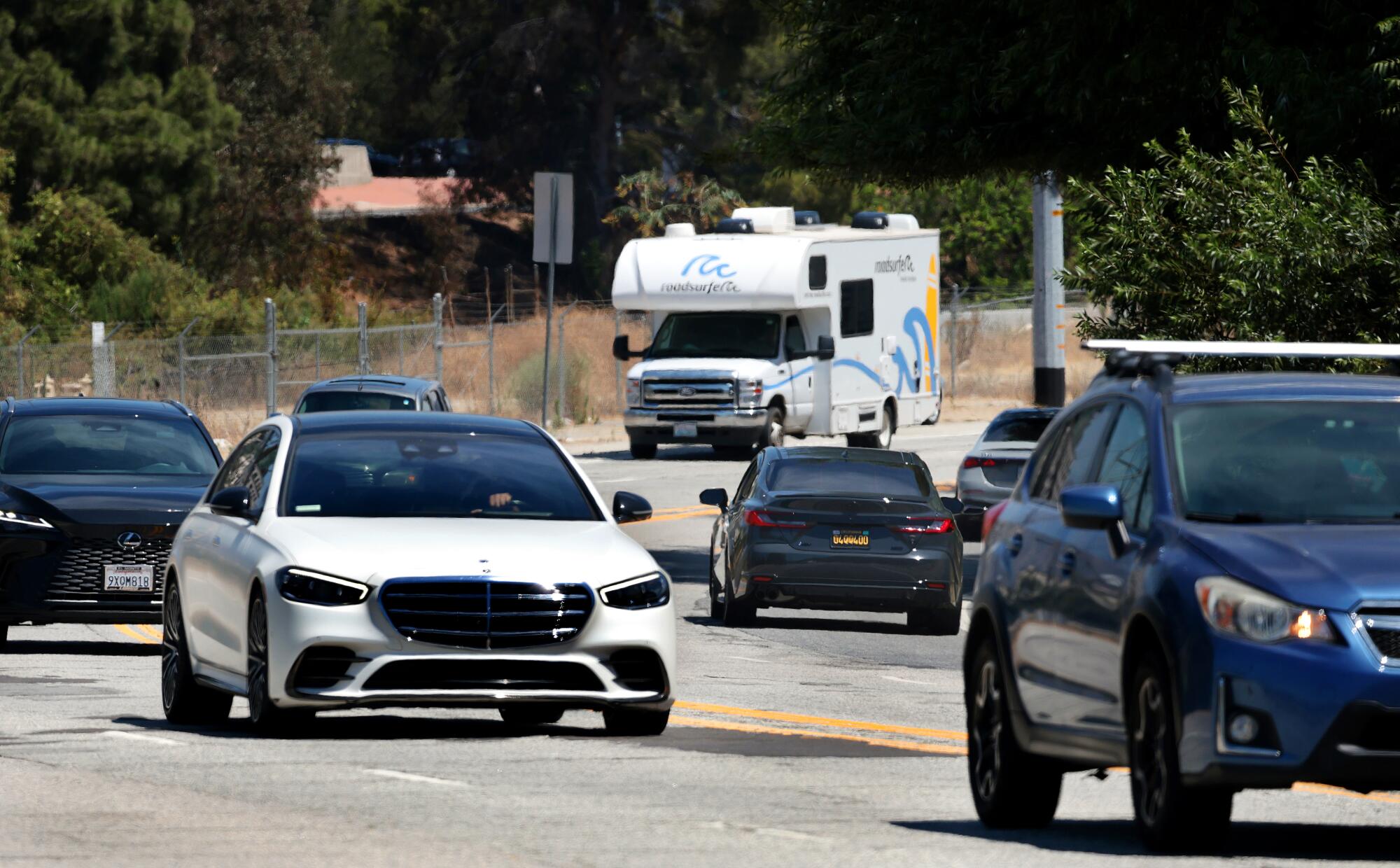 Vehicles on a road.
