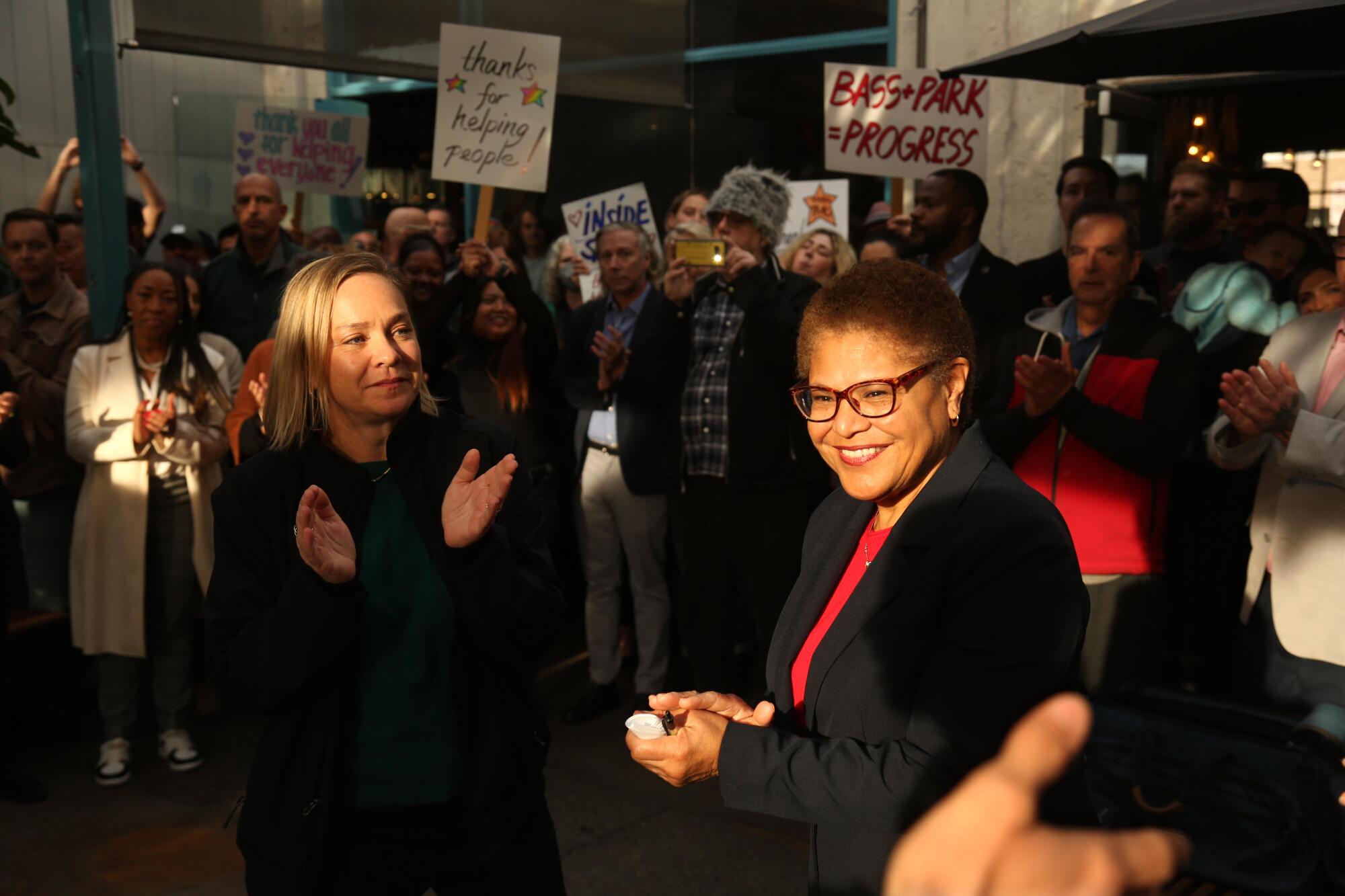 Los Angeles City Council Member Traci Park and residents of Venice applaud Los Angeles Mayor Karen Bass.