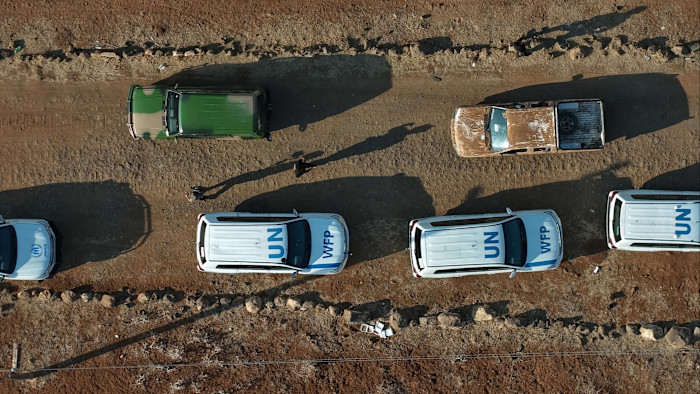 White UN-marked vehicles seen from above