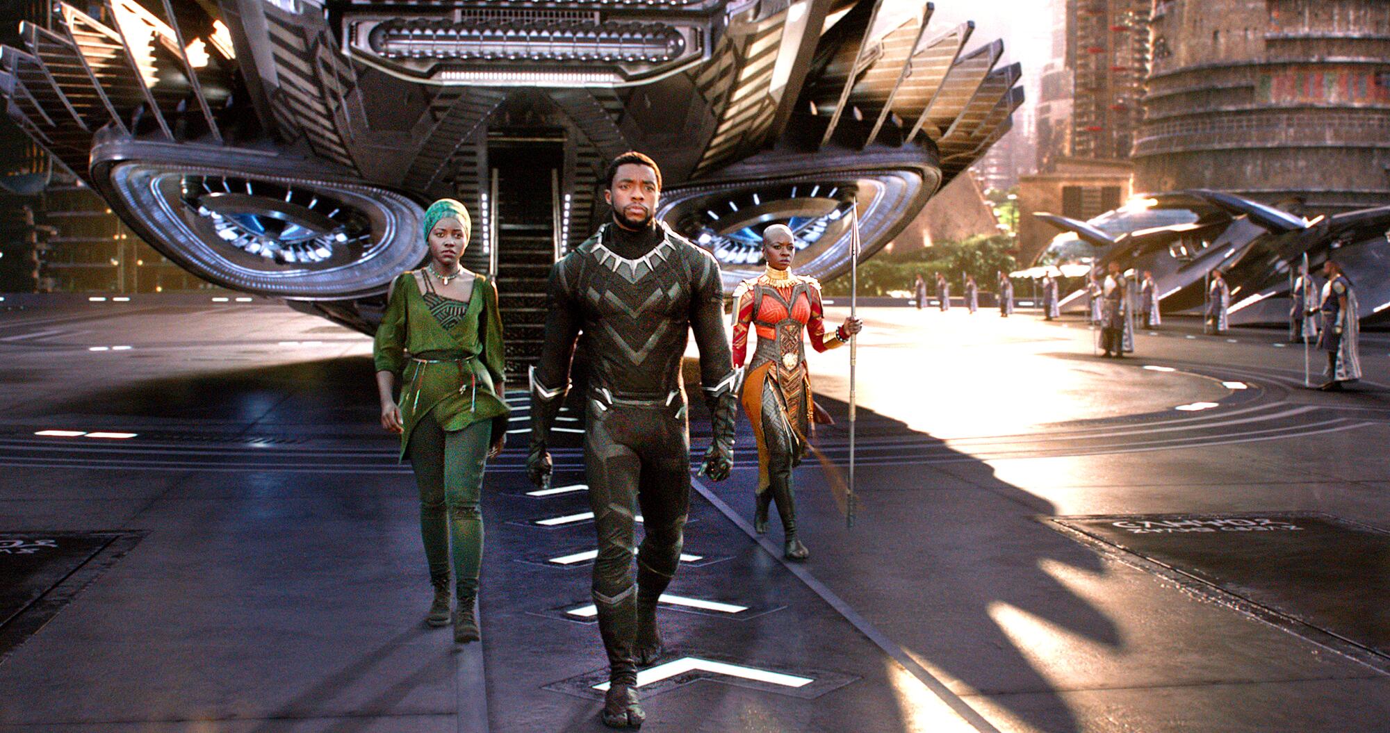 Lupita Nyong'o, left, Chadwick Boseman and Danai Gurira in Marvel's "Black Panther."