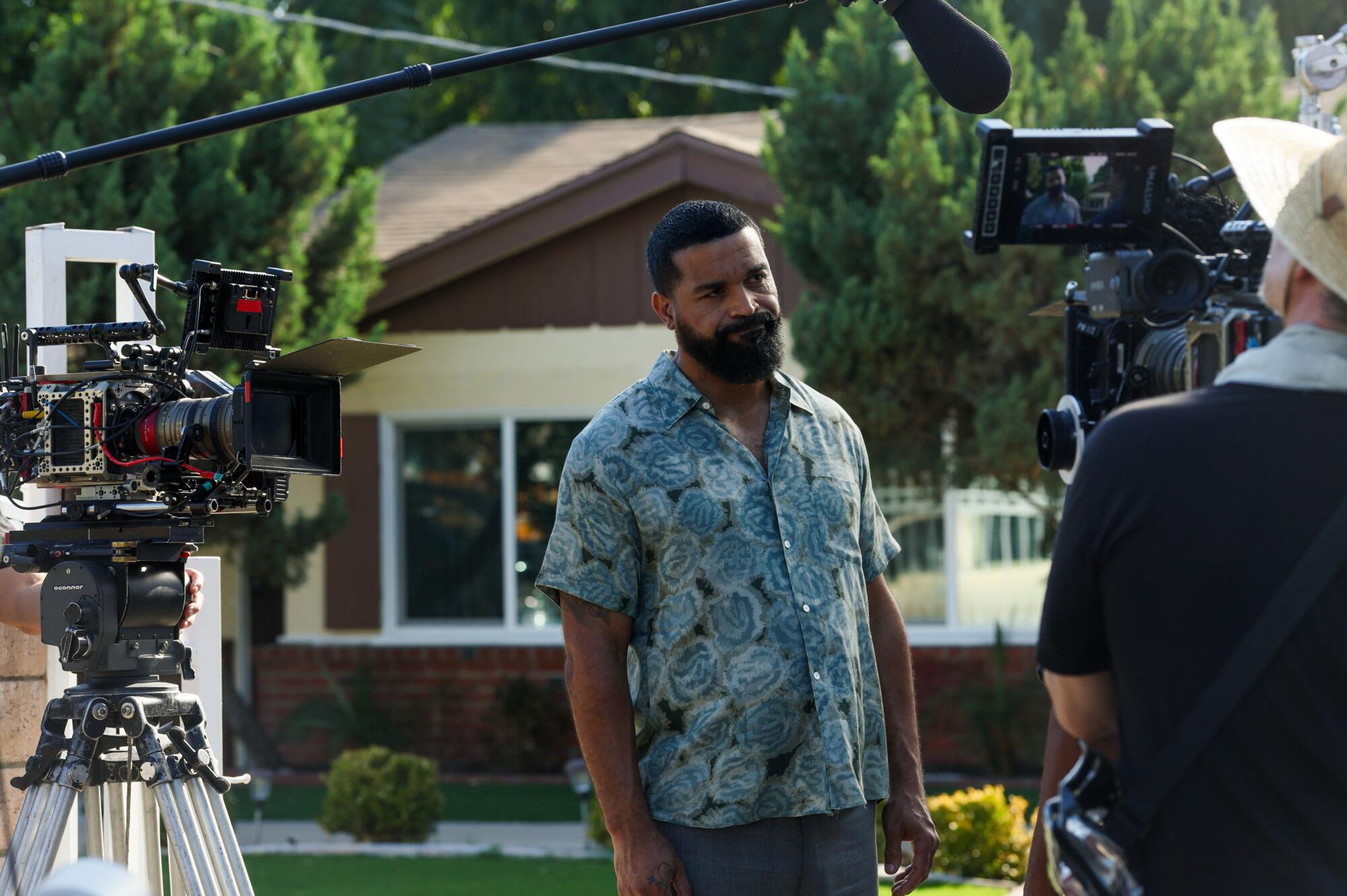 Actor Celestino Camille works on a scene for the film "The Seed" in a residential neighborhood in North Hollywood on Tuesday.