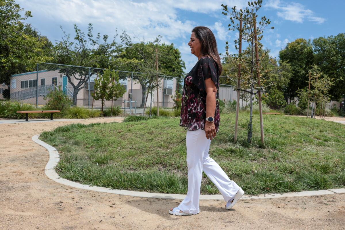 Principal Simer Garcha walks through garden at Pacoima Middle School.