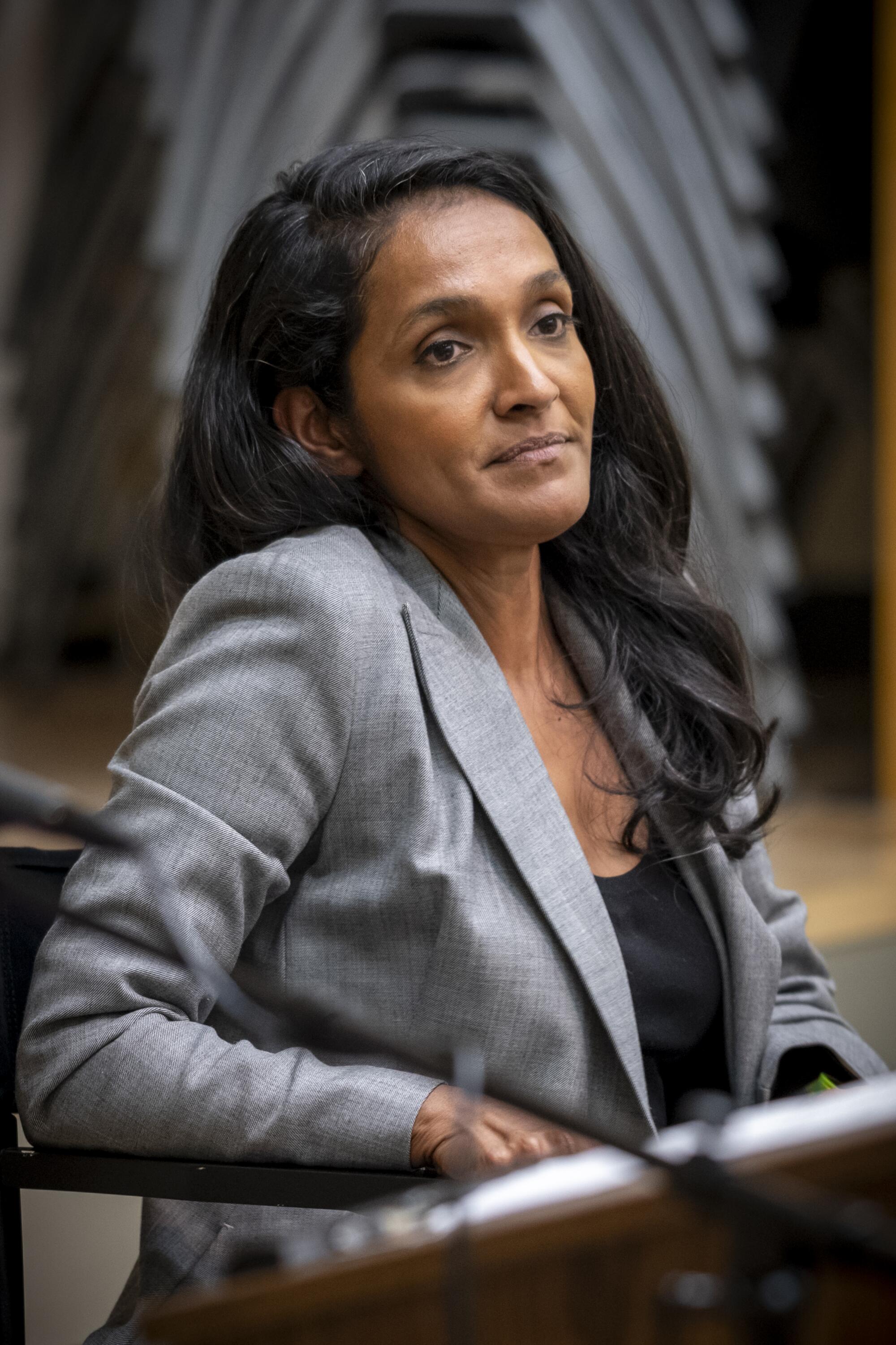 Nithya Rama listens to a question at a mayoral debate.