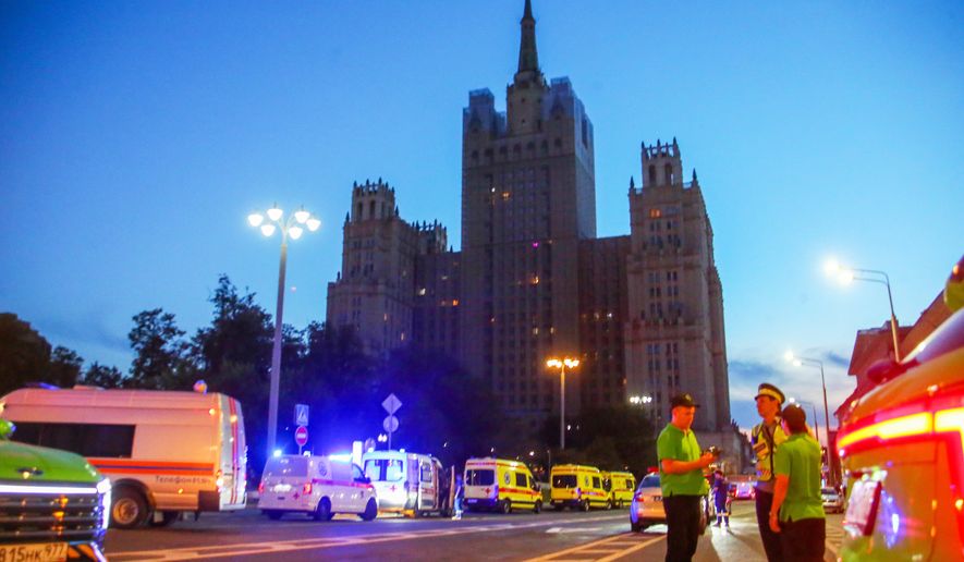 Emergency vehicles are parked in an area near a deadly explosion at a restaurant in Moscow, Saturday, Aug. 1, 2026. (Sergei Vedyashkin/Moscow News Agency via AP)