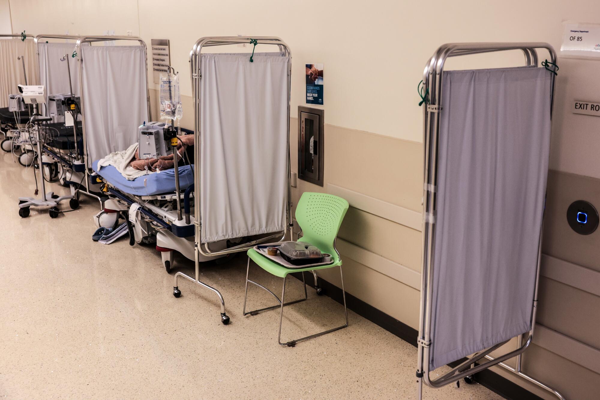 Hallways are used as treatment space as the emergency department operates beyond capacity.