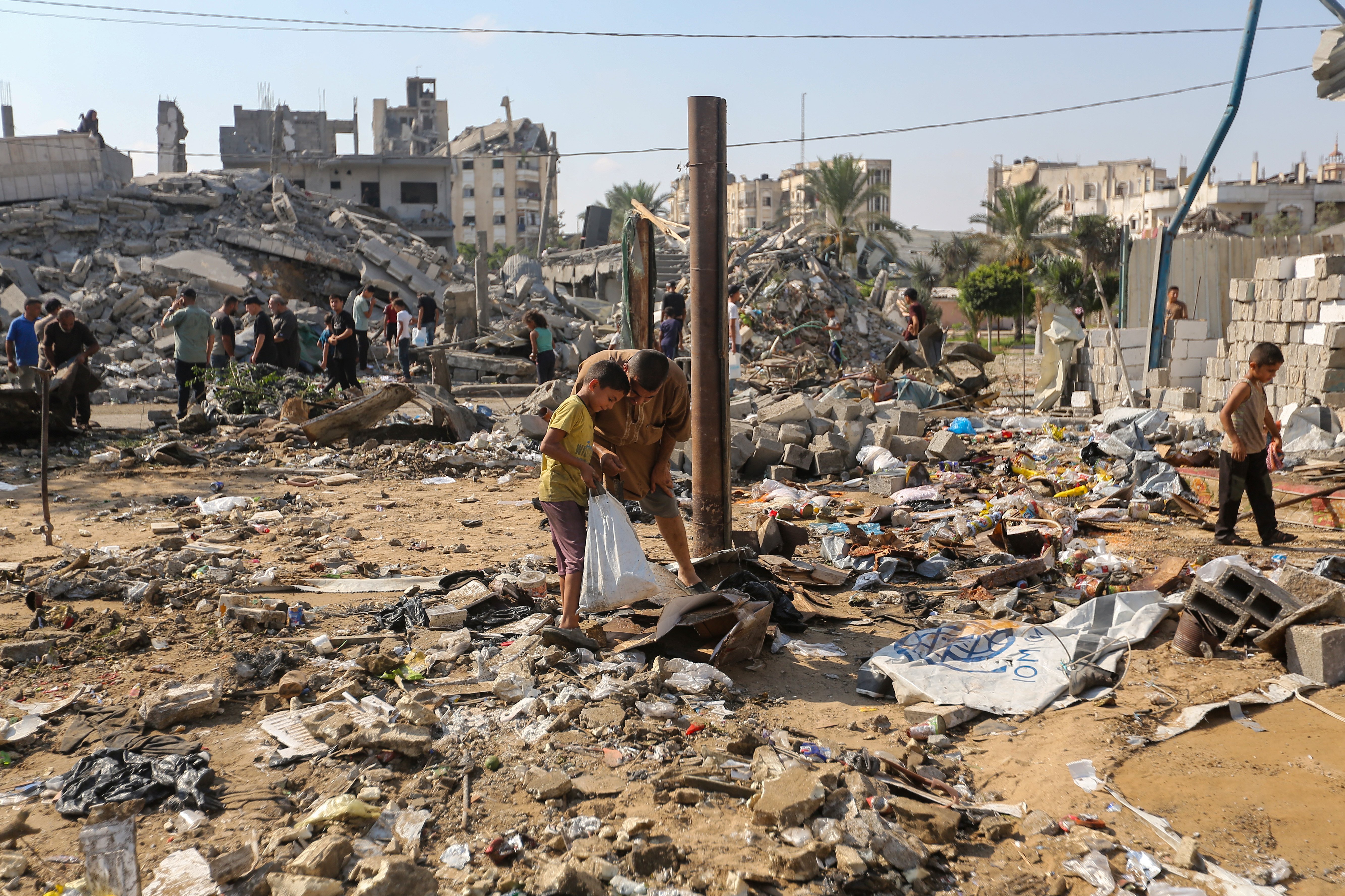 GAZA CITY, GAZA - AUGUST 1: Residents inspect the damage caused by Israeli airstrikes last night on residential buildings in the Safatawi area on August 1, 2026 in Gaza City, Gaza. Israel continues military actions in Gaza during the fragile easefire agreement which is frequently contested, and marred by mutual accusations of violations. (Photo by Ahmad Hasaballah/Getty Images)
