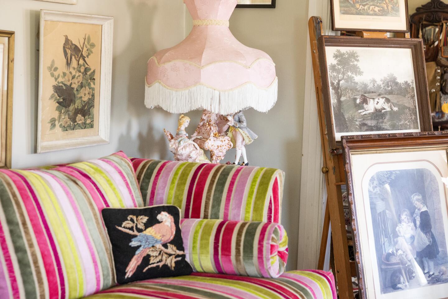 SILVER LAKE, CA - JULY 17, 2026: Wendi Weger's Versailles-inspired apartment in Silver Lake, CA on Friday, July 17, 2026. Sofa is covered in Christian Lacroix fabric. A Capodimonte lamp and vintage prints. (Myung J. Chun / Los Angeles Times)