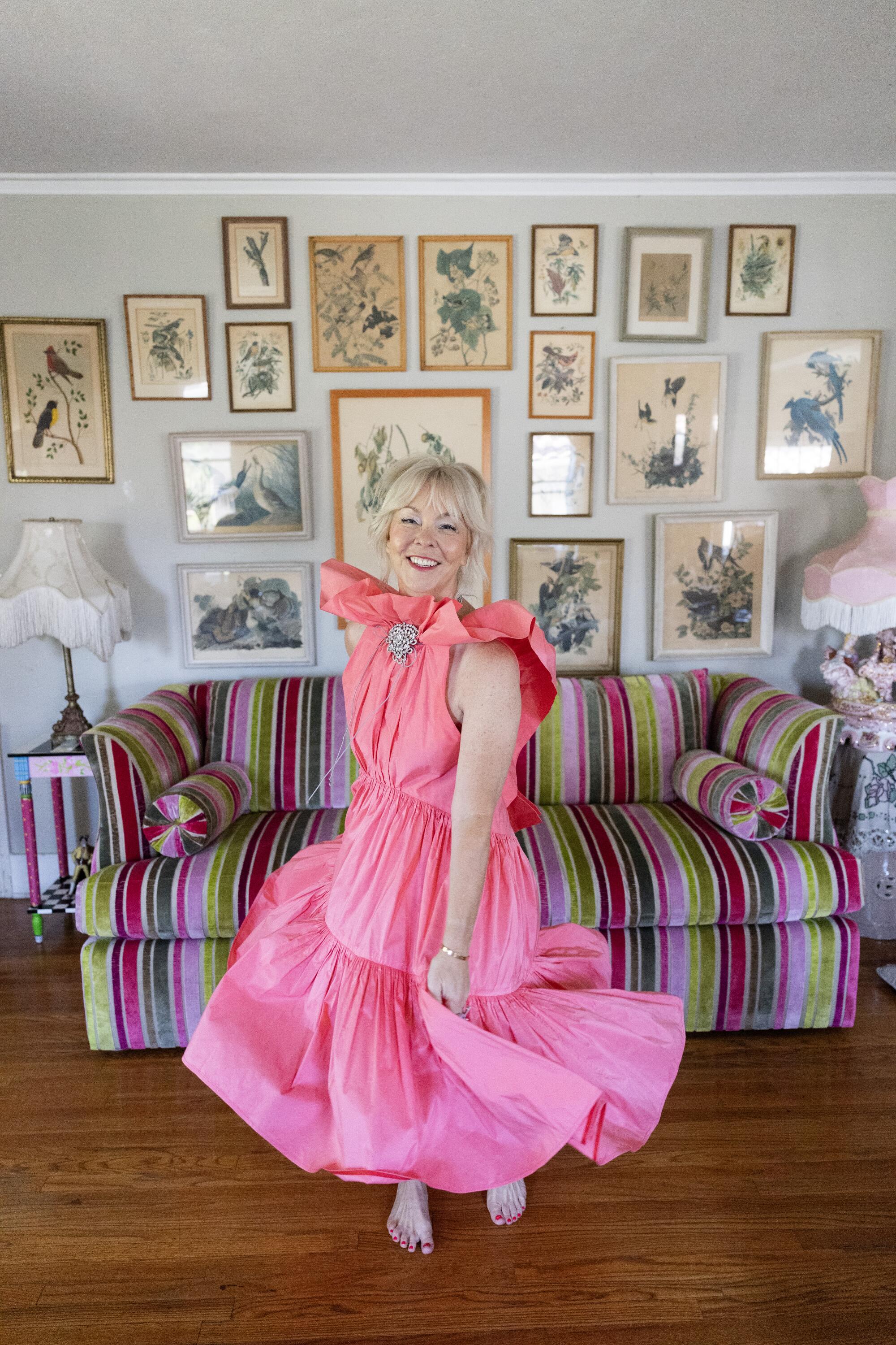 Wendi Weger twirls in a pink Batsheva dress in her living room.