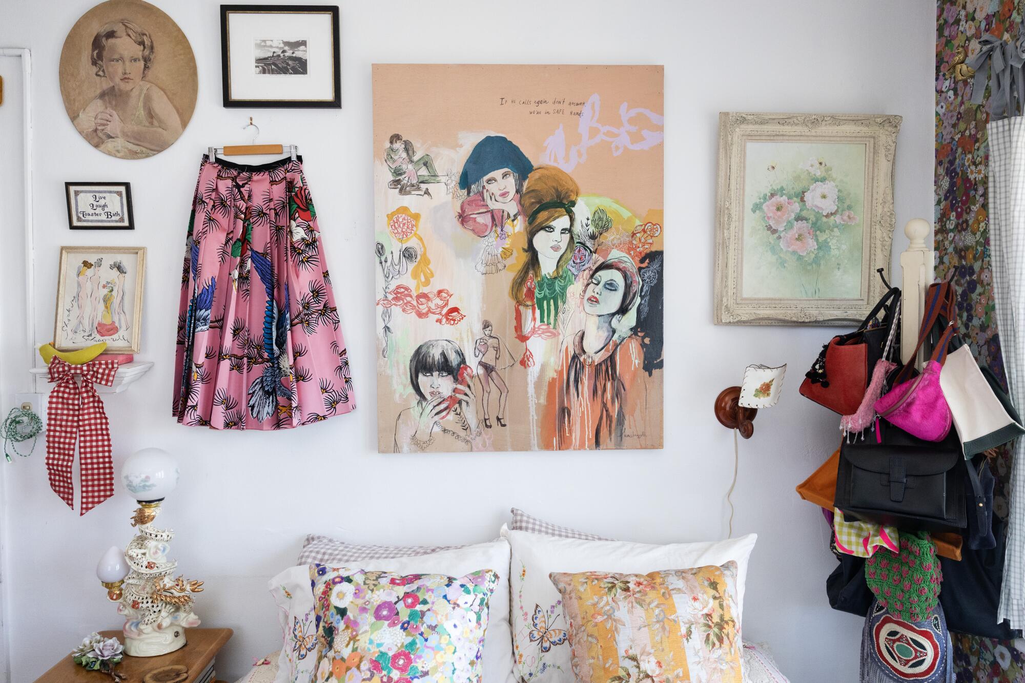 A Gucci skirt and artworks hang in a bedroom.
