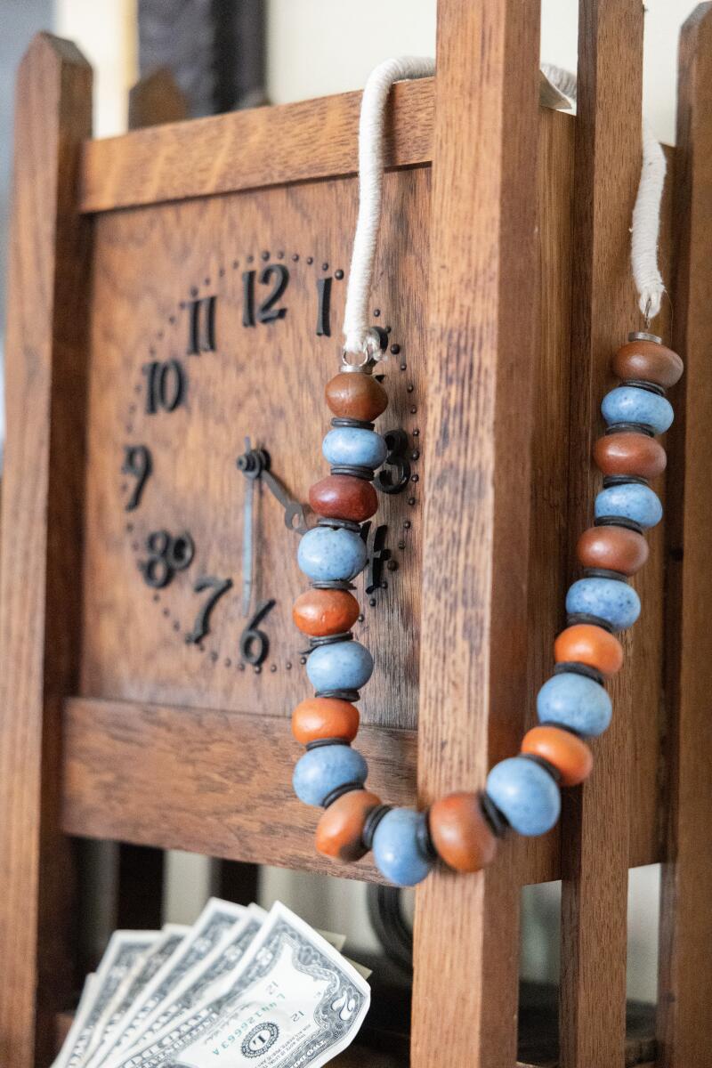 Doyle Lane beads, a clock and $2 bills.