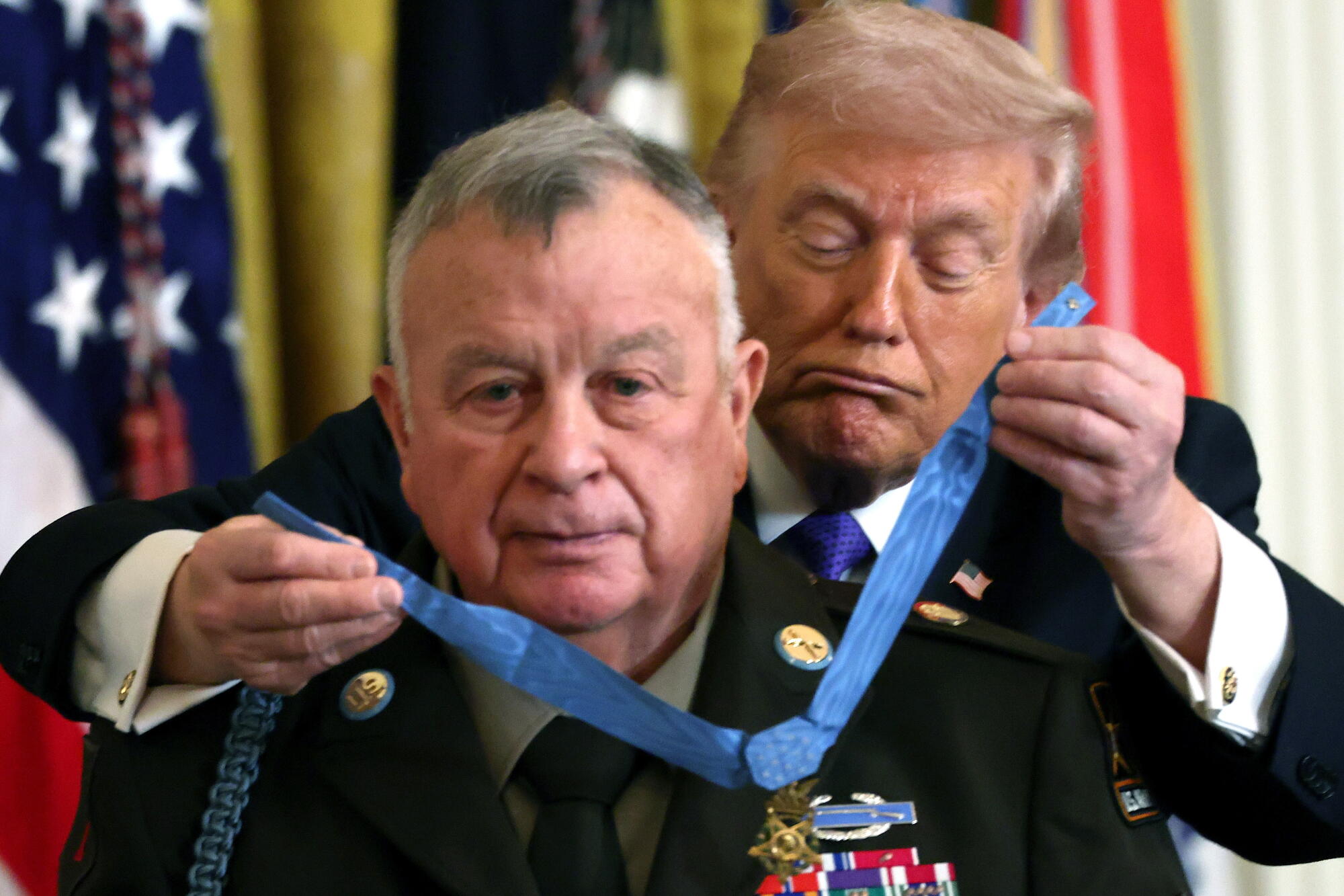 Ret. Command Sgt. Maj. Terry P. Richardson is presented the Medal of Honor by President Trump