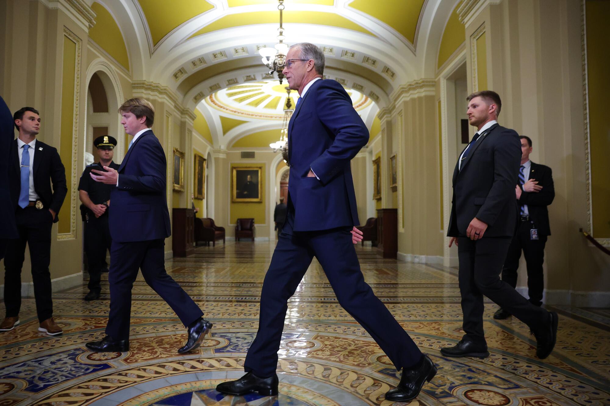 Sen. Majority Leader John Thune and others at the U.S. Capitol
