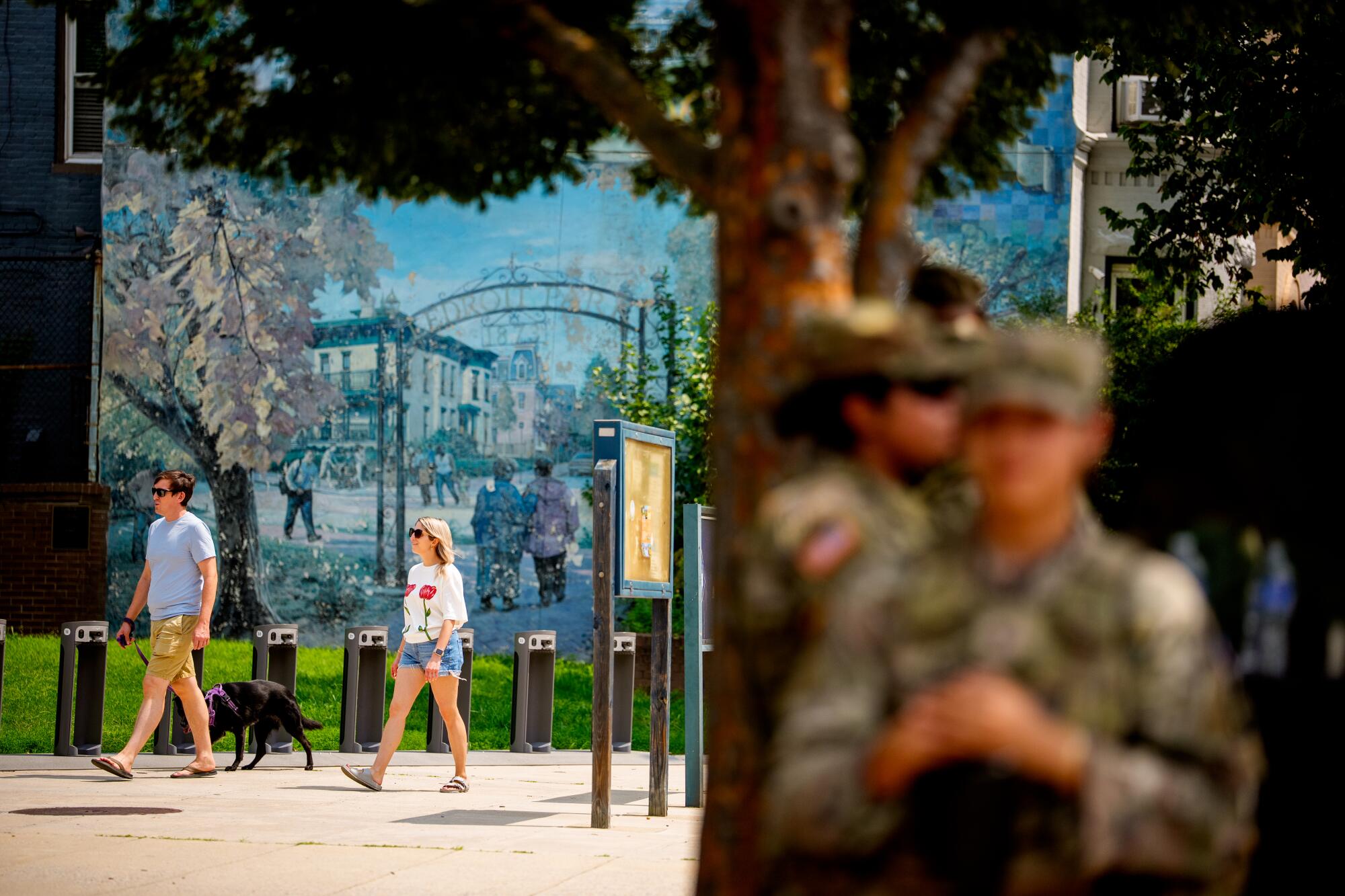 National Guard troops stand in the shade at The Park at LeDroit