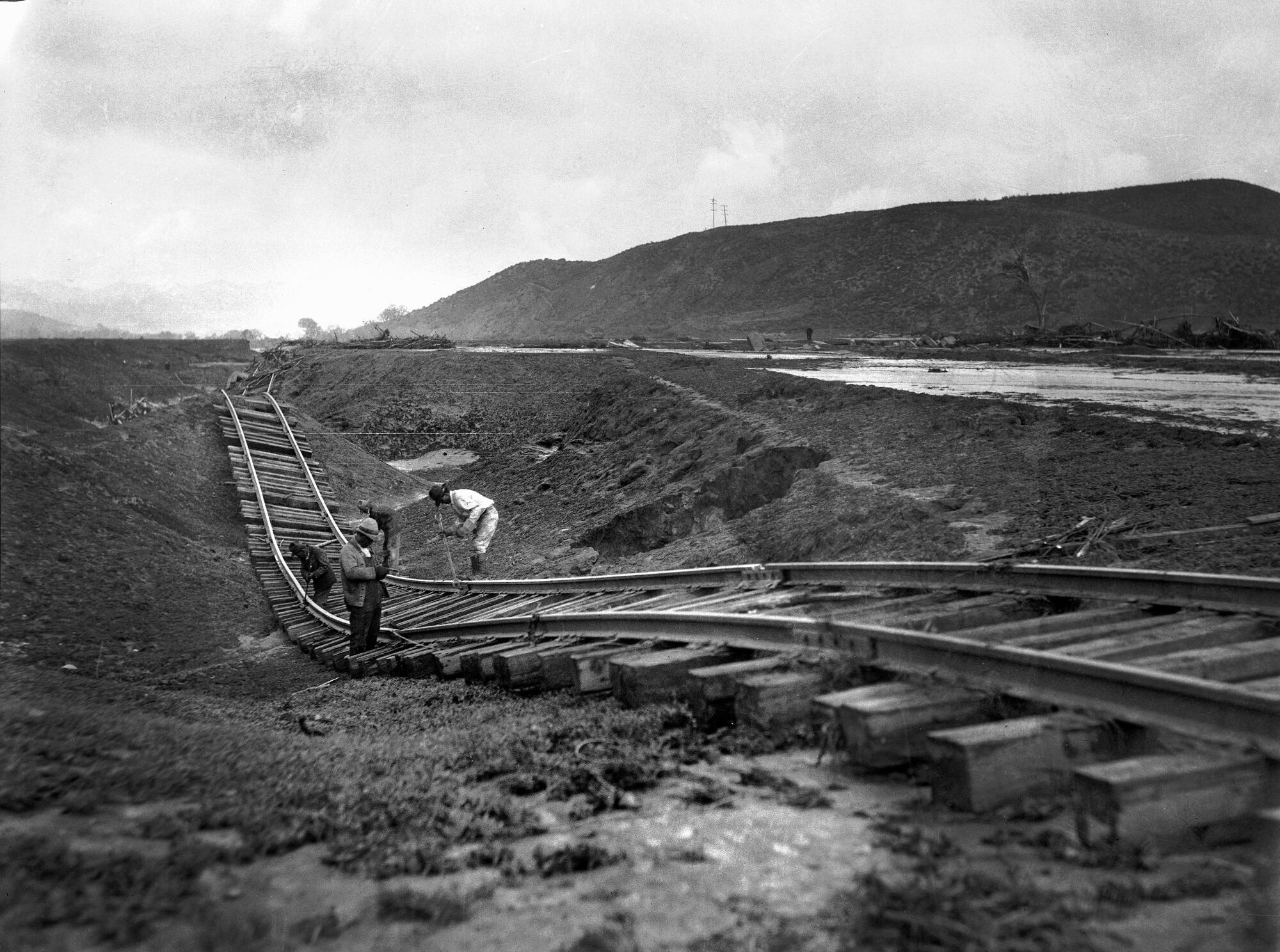March 13, 1928: Flood twisted railroad track in Castaic following collapse of St. Francis Dam. 