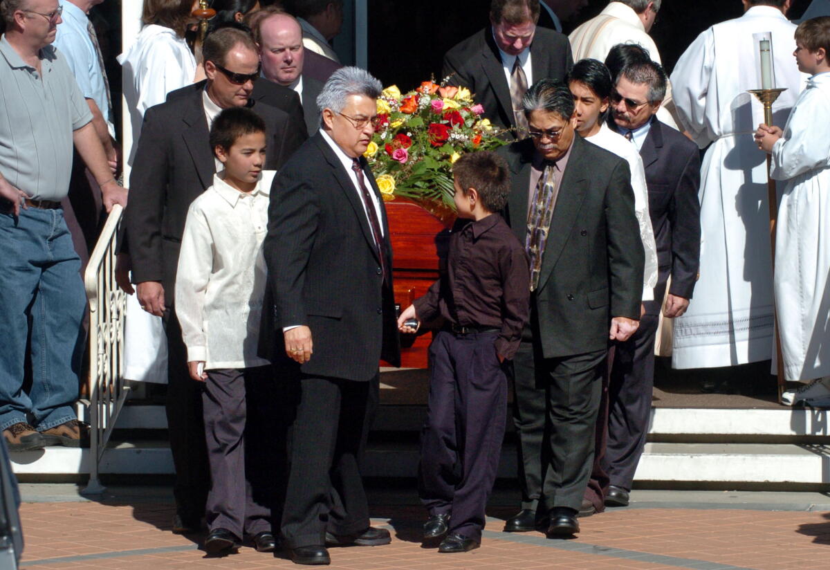 Charlotte Colton's casket is carried out of St. Raphael's Church at the end of her funeral service in Goleta in 2006.