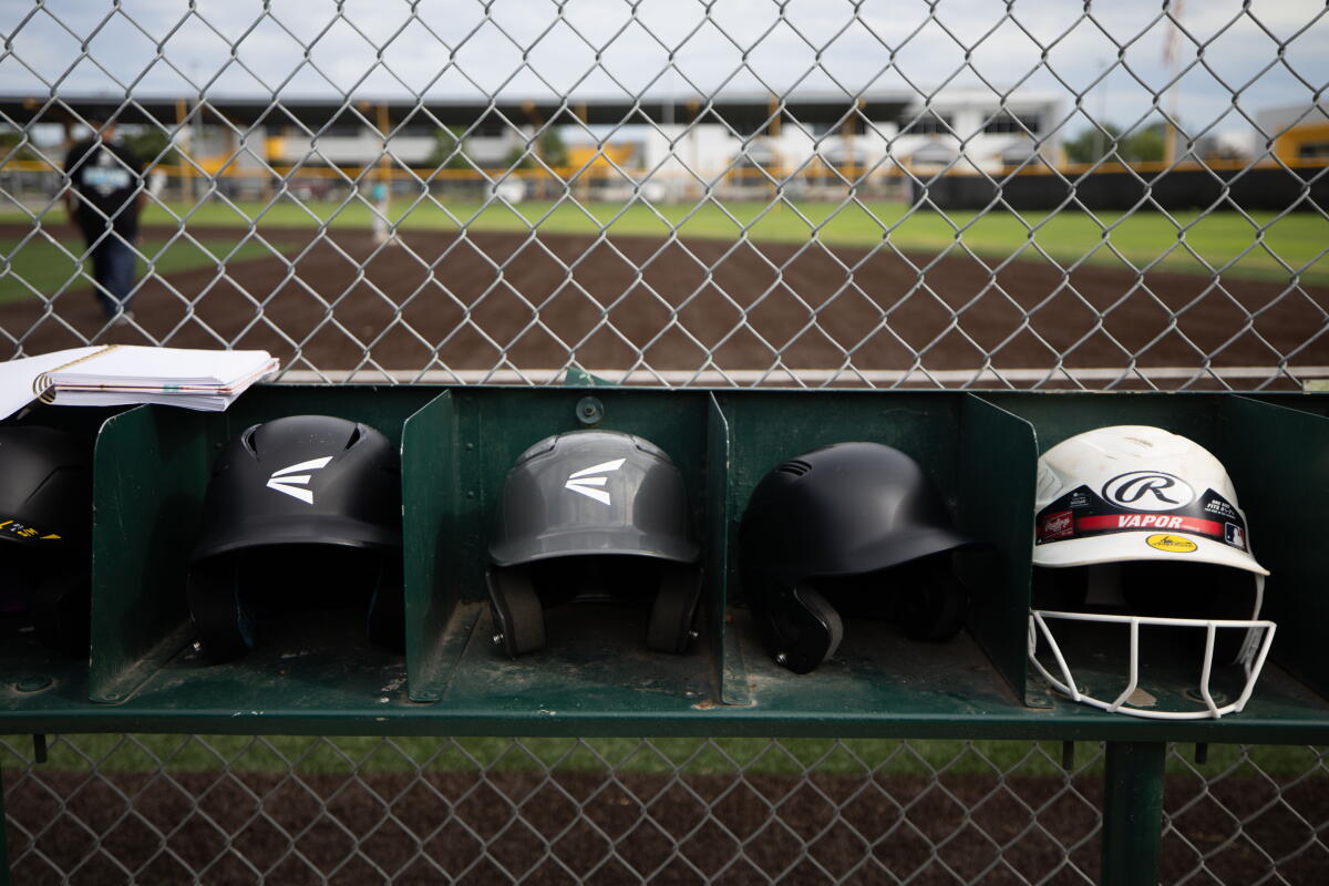 Helmets lined up for batting.