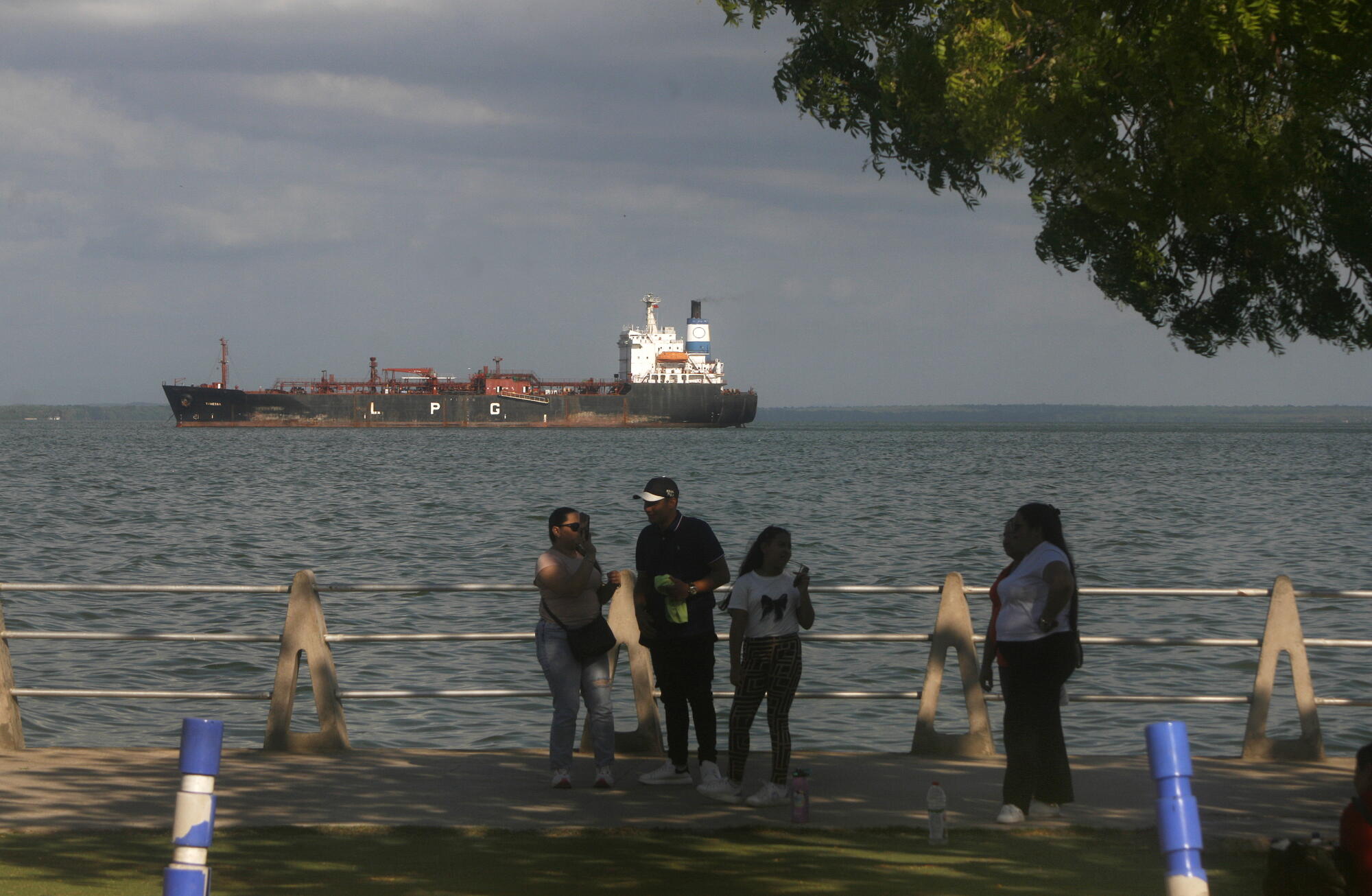 Venezuelans watch oil tankers anchored in Lake Maracaibo