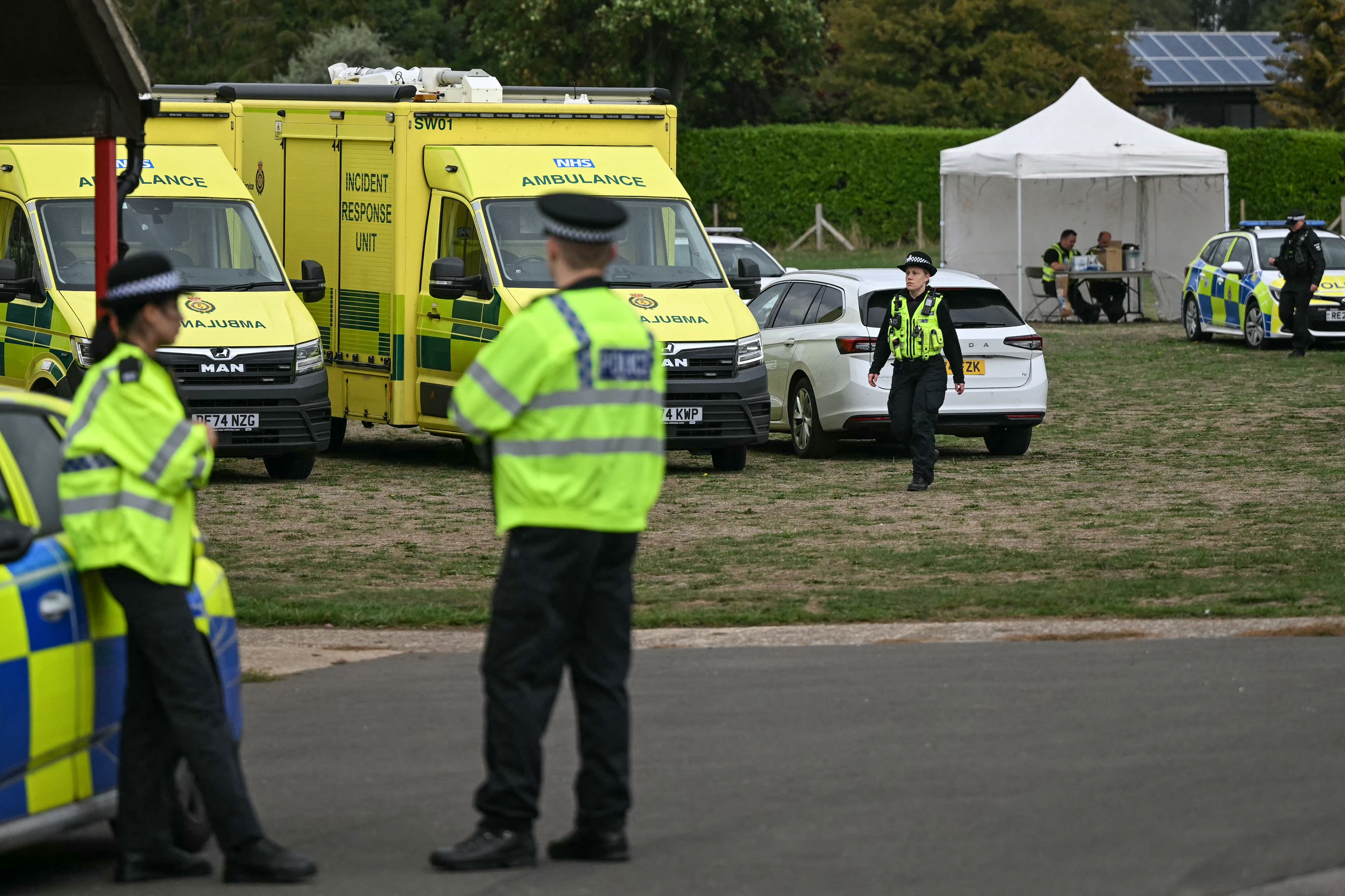 Police are pictured at a base set up at the Fairford Youth Football Club near RAF Fairford base, south-west England on September 27, 2026, as UK counter-terrorism police investigate an incident near the base in the village of Whelford. British police on September 27 declared a major incident and evacuated villagers living near a base used by the US air force after arresting several men on suspicion of explosives offences. (Photo by JUSTIN TALLIS / AFP via Getty Images)