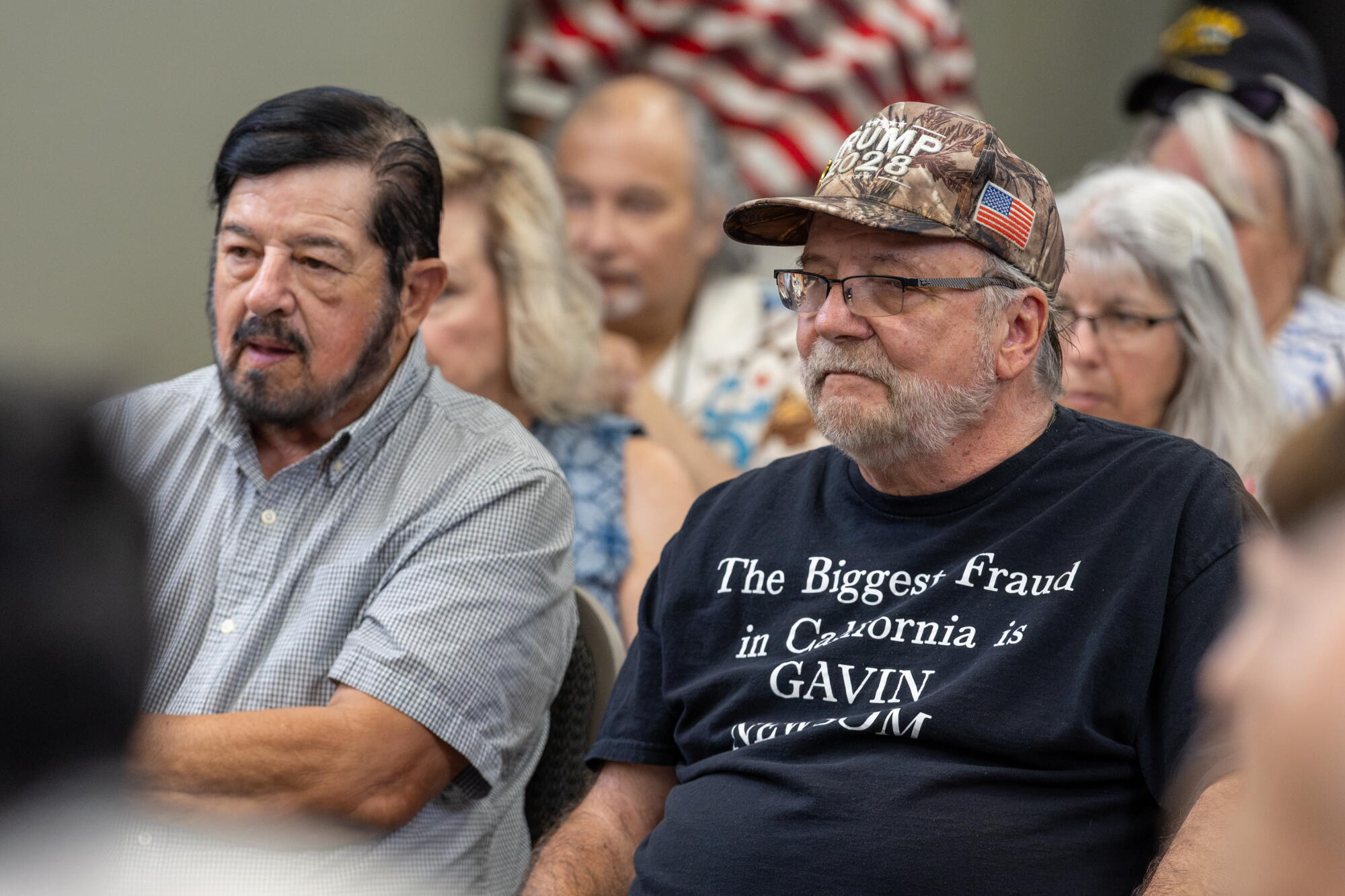 Robert Rivera, left, San Jose resident, and Corky Galey, Modesto resident, listen to Gubernatorial candidate Steve Hilton