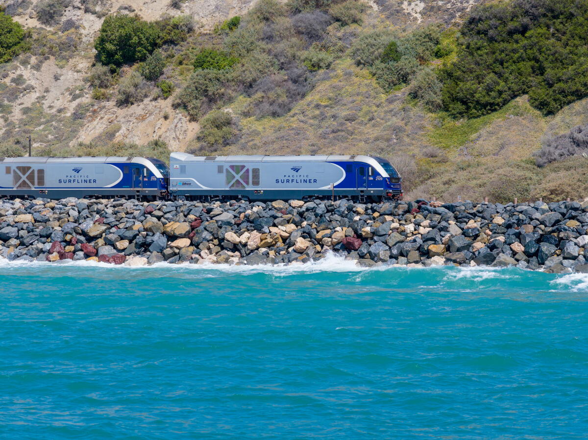 An Amtrak Pacific Surfliner train passes along the coastal tracks in San Clemente.