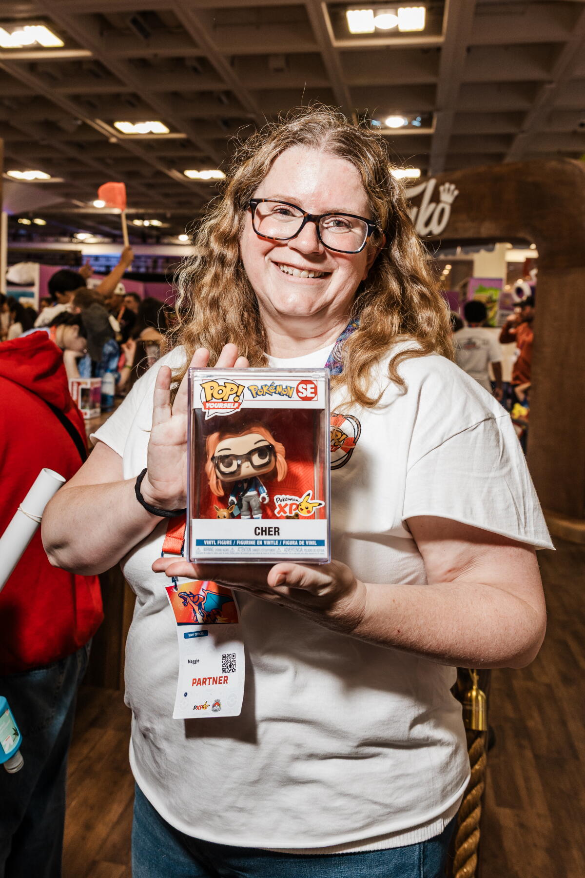 A Funko employee holding up a boxed toy
