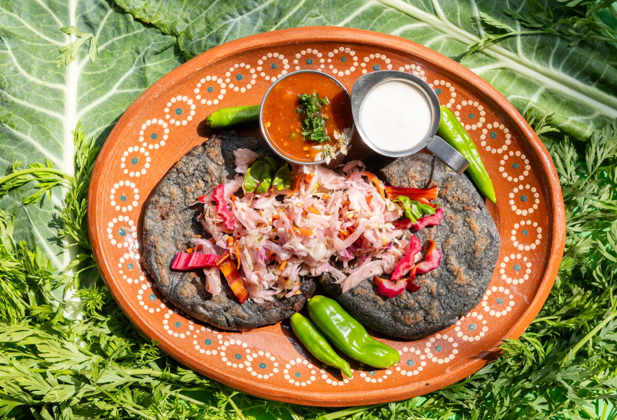 Pupusas made with optional blue corn masa at Delmy's Pupusas in Los Angeles