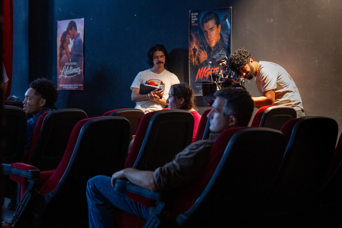 Filmmakers work in the theater set at Dhar Mann Studios.