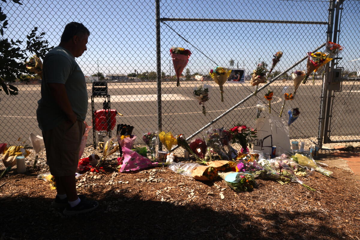 Francisco Ortiz pays his respects at a makeshift memorial for reporter Eliana Moreno and pilot George Marciniw.
