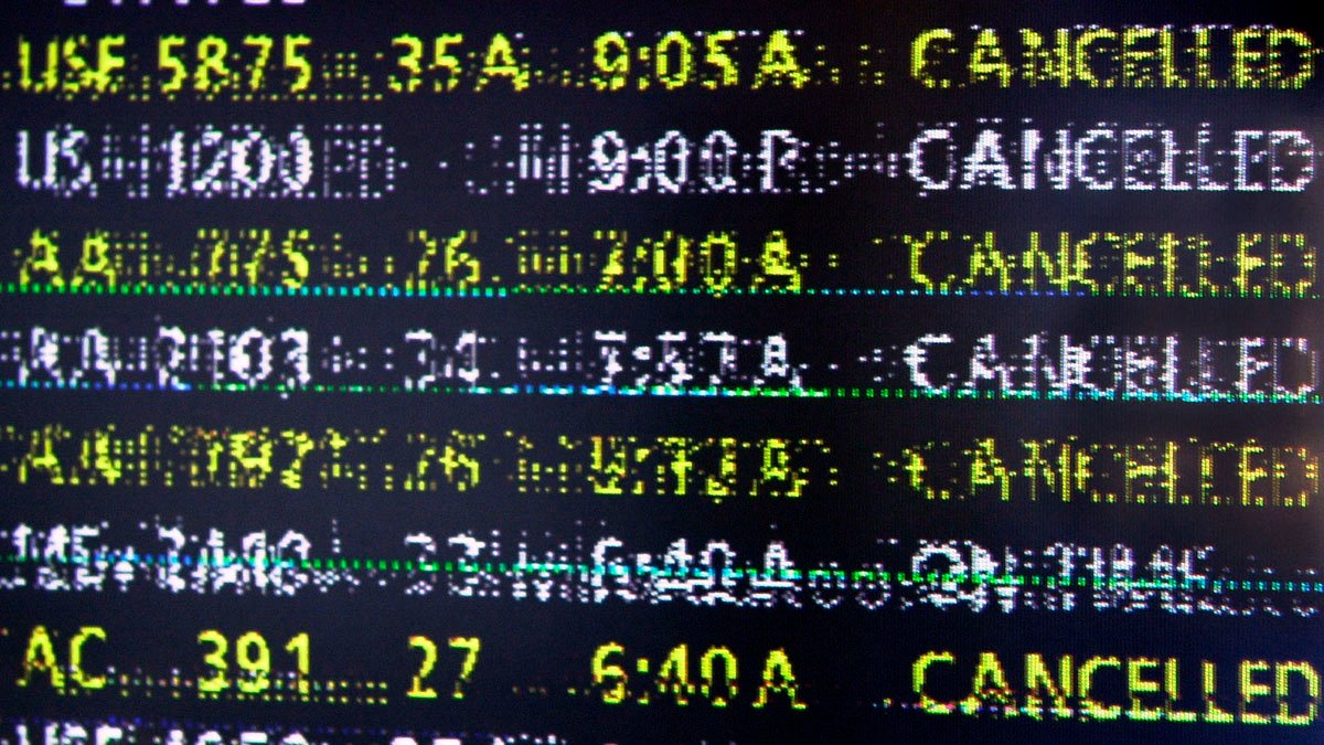 WASHINGTON, DC - SEPTEMBER 15: A malfunctioning computer screen displays cancelled flights in the terminal of Reagan National Airport across the Potomac River from Washington DC 15 September 2001. Reagan airport, due to its immediate proximity to the White House and other government buildings, is the last major US airport that remains closed in the aftermath of the airborne terrorist attacks on the World Trade Center and Pentagon. (Photo credit should read MIKE THEILER/AFP via Getty Images)
