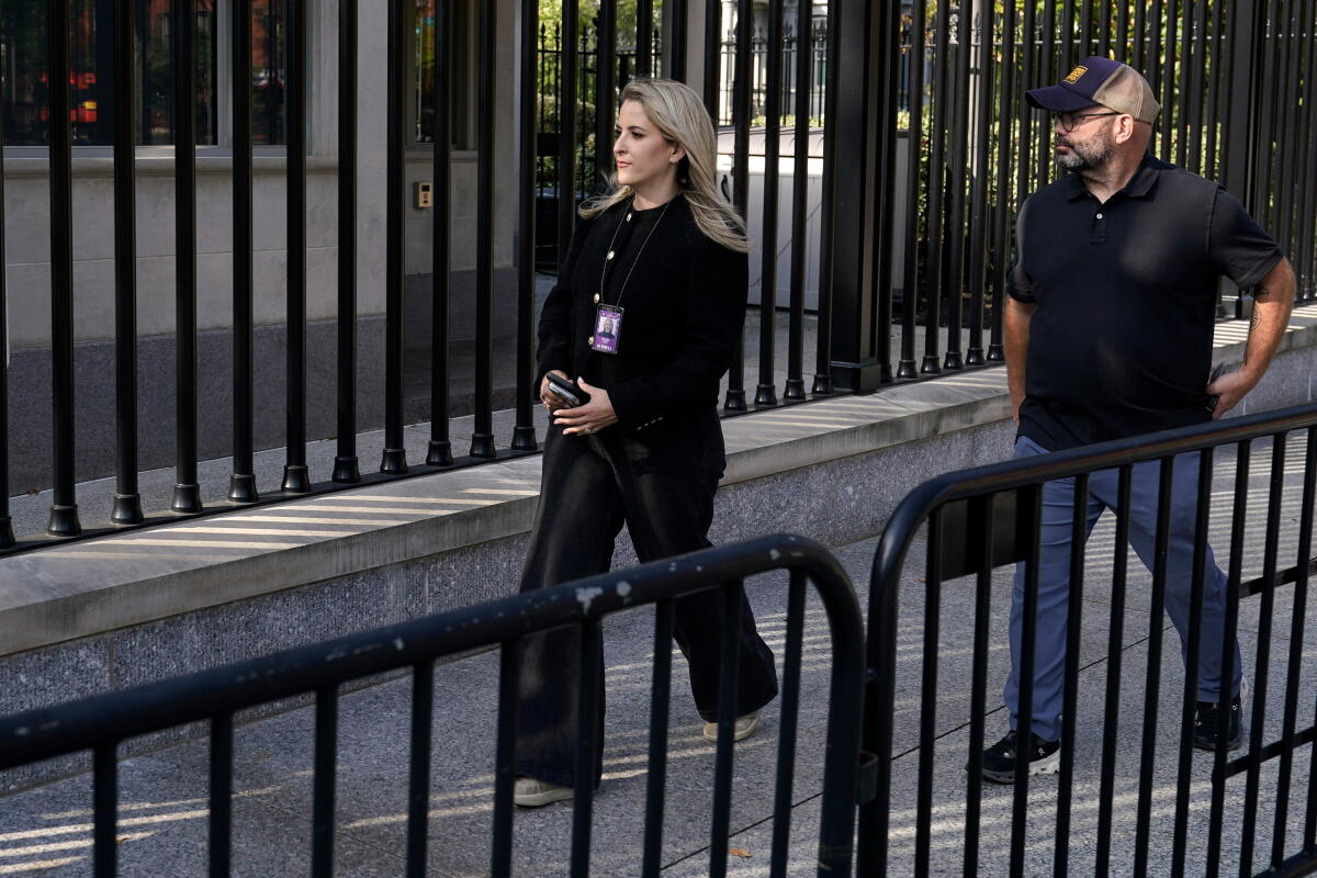 CNN senior White House reporter Betsy Klein walks to the White House on Saturday.