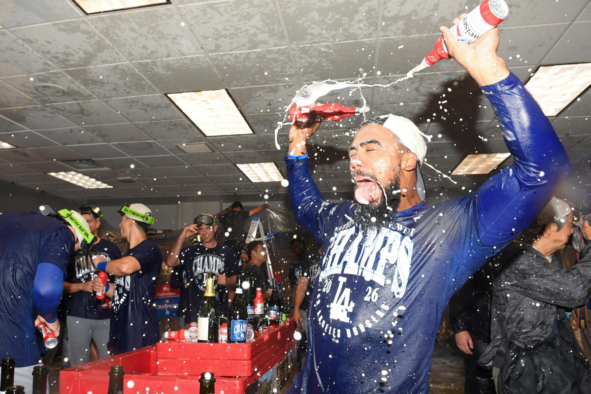 Los Angeles Dodgers left fielder Teoscar Hernández celebrates with teammates.