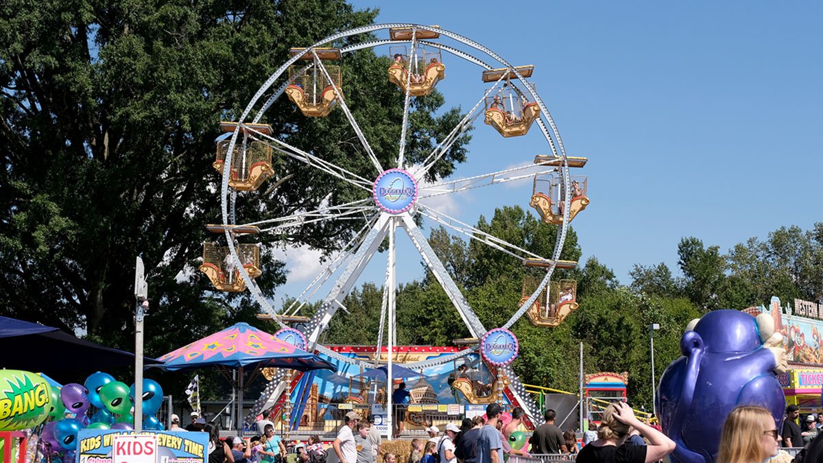 Doswell, Virginia USA: September 28th 2024: The Ferris Wheel starts in motion at the State fair of Virginia which is one of many rides that you can partake in.