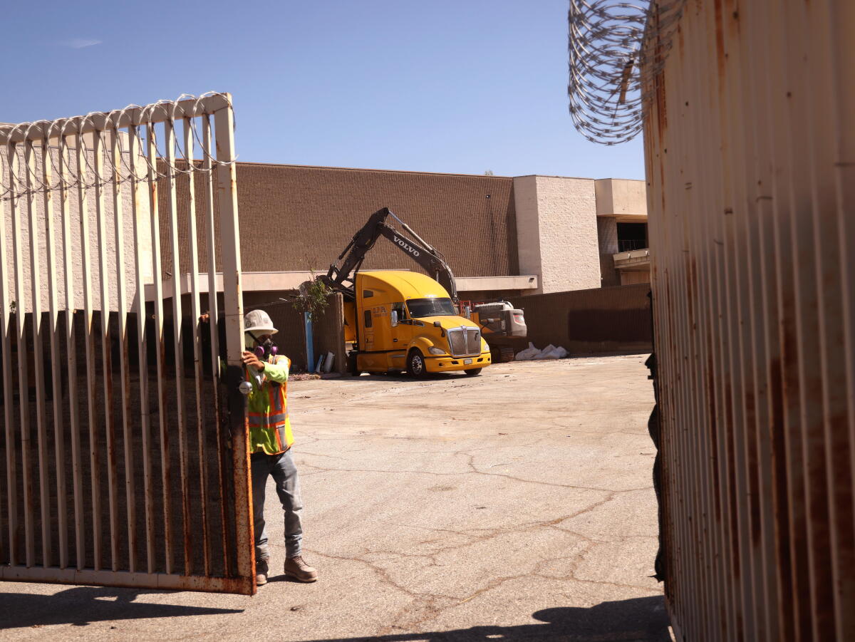 Demolition work is taking place behind closed gates at Hawthorne Plaza.