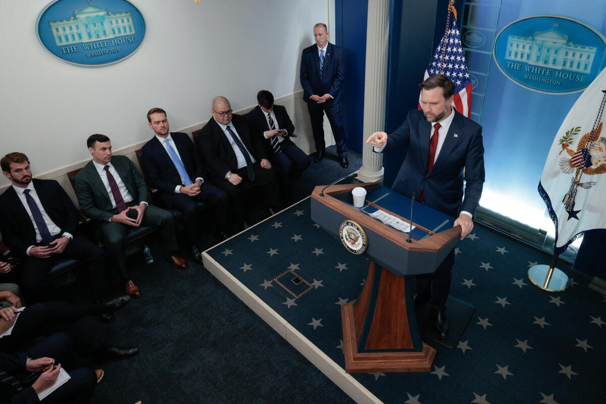 Vice President JD Vance talks to reporters during a news briefing