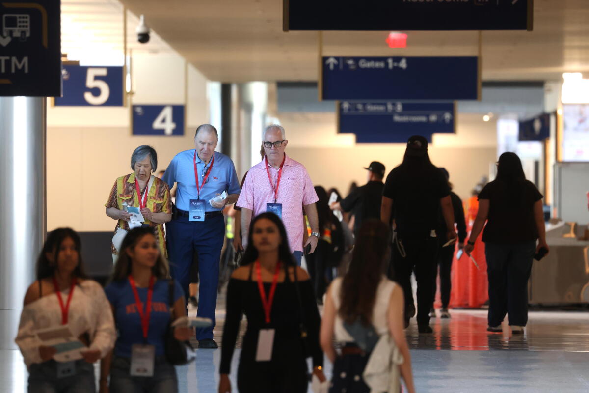 Volunteers, playing passengers, make their way through the Hollywood Burbank Airport in Burbank on September 19, 2026.