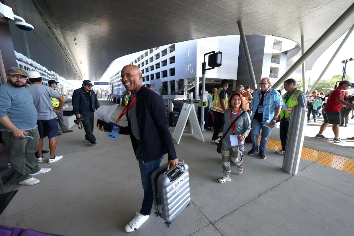 Volunteers, playing passengers, arrive at The Hollywood Burbank Airport in Burbank on September 19, 2026.