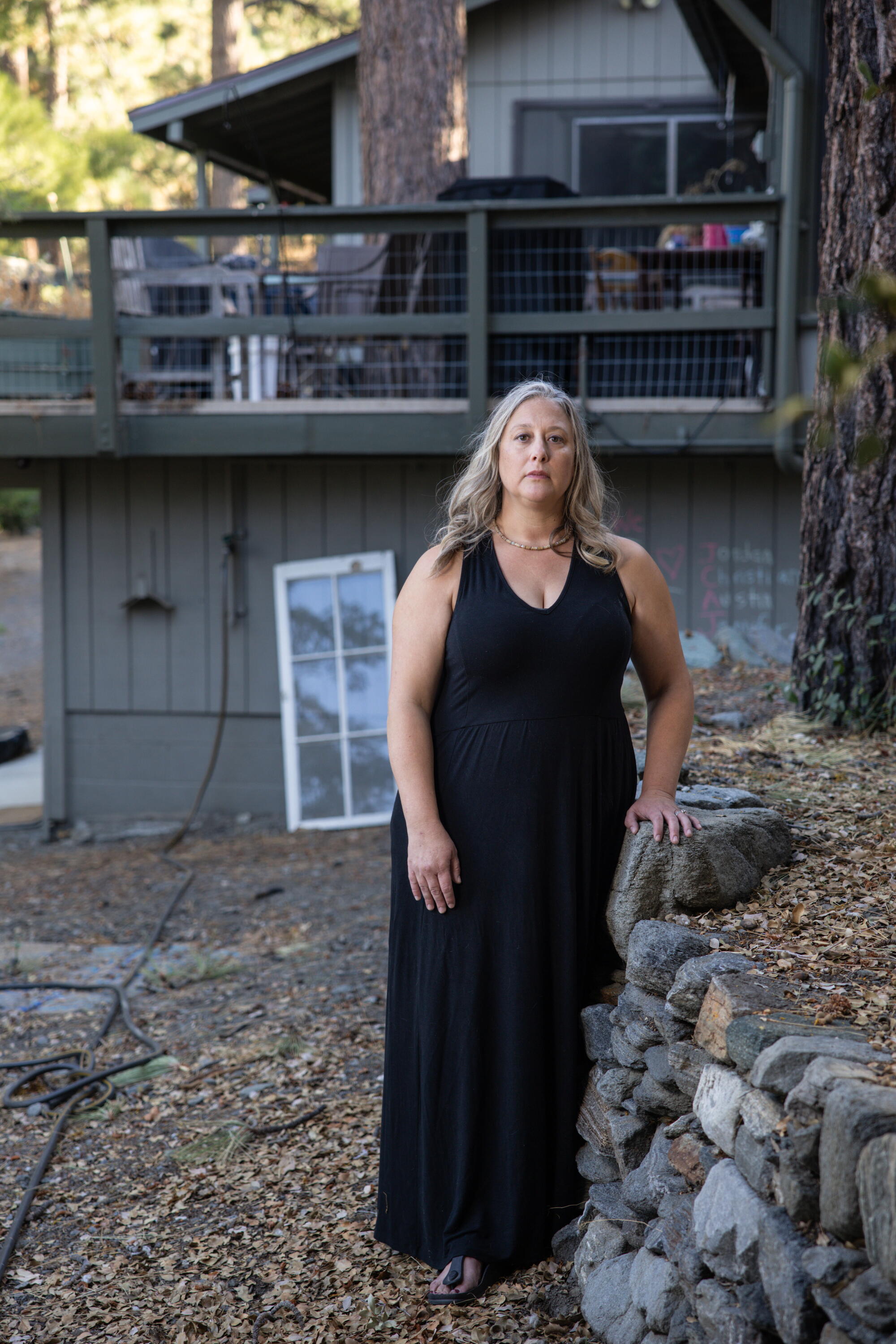 Jennifer Unibe, who works for the Lone Pine Canyon Protection Alliance, outside her home in Wrightwood.