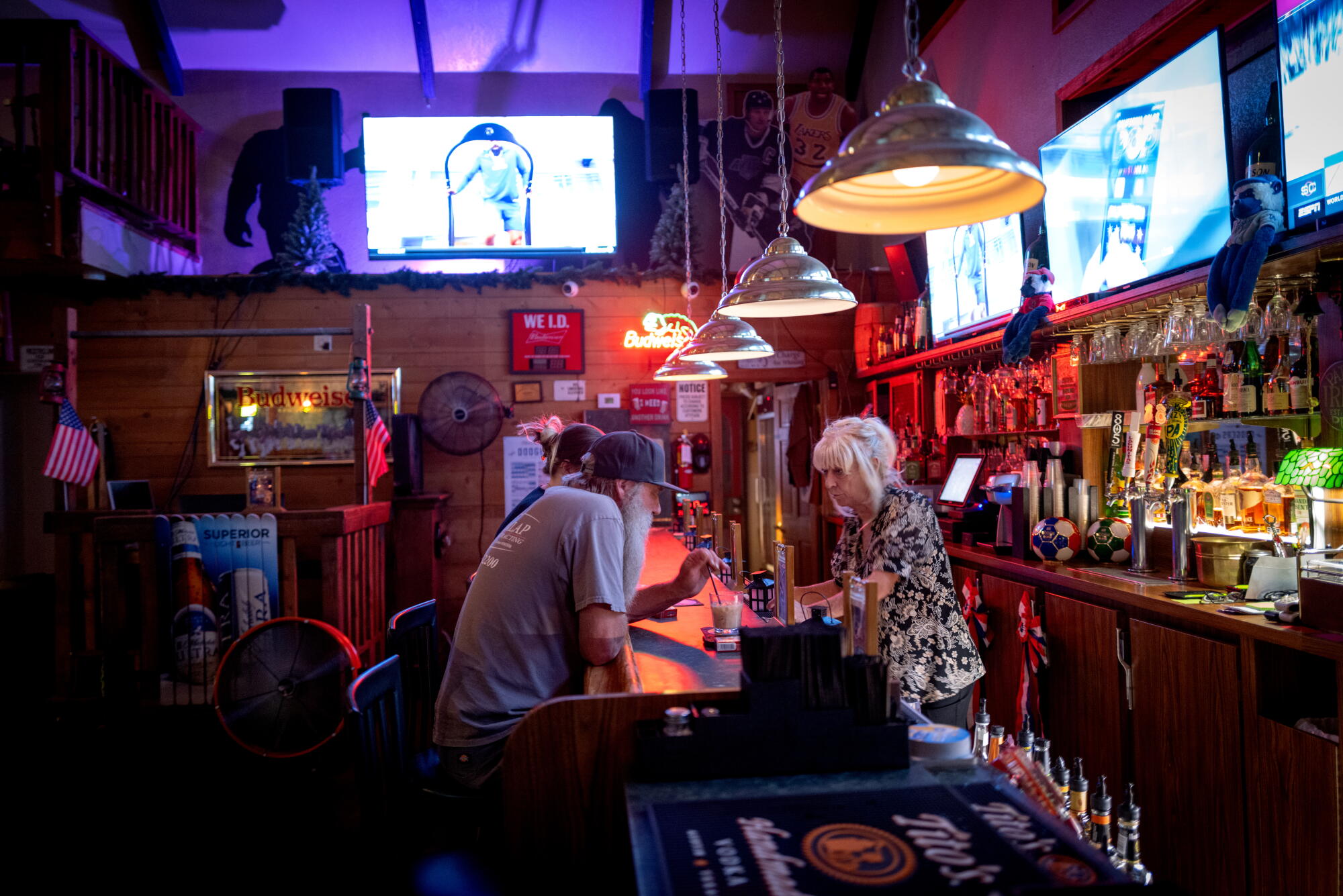 A bartender chats with customers at the Wrightwood Inn.